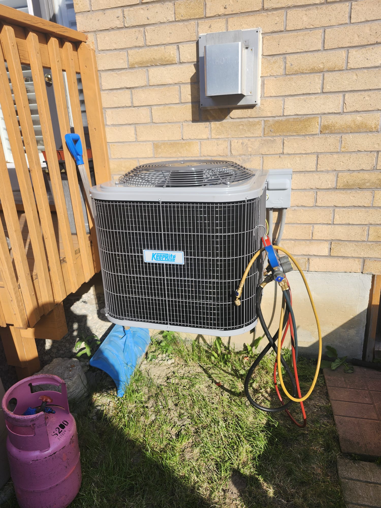 New KeepRite air conditioner installed and pressure tested outside a home